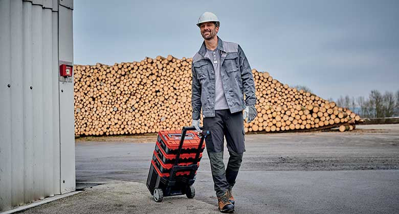man with system carrying case